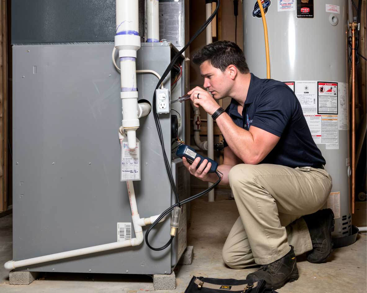 HVAC technician performing a furnace tune-up in Tempe